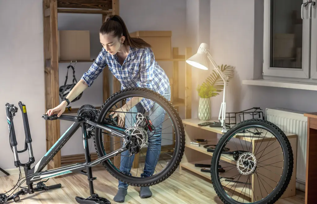 woman-is-performing-maintenance-his-mountain-bike-concept-fixing-preparing-bicycle-new-season (1).jpg